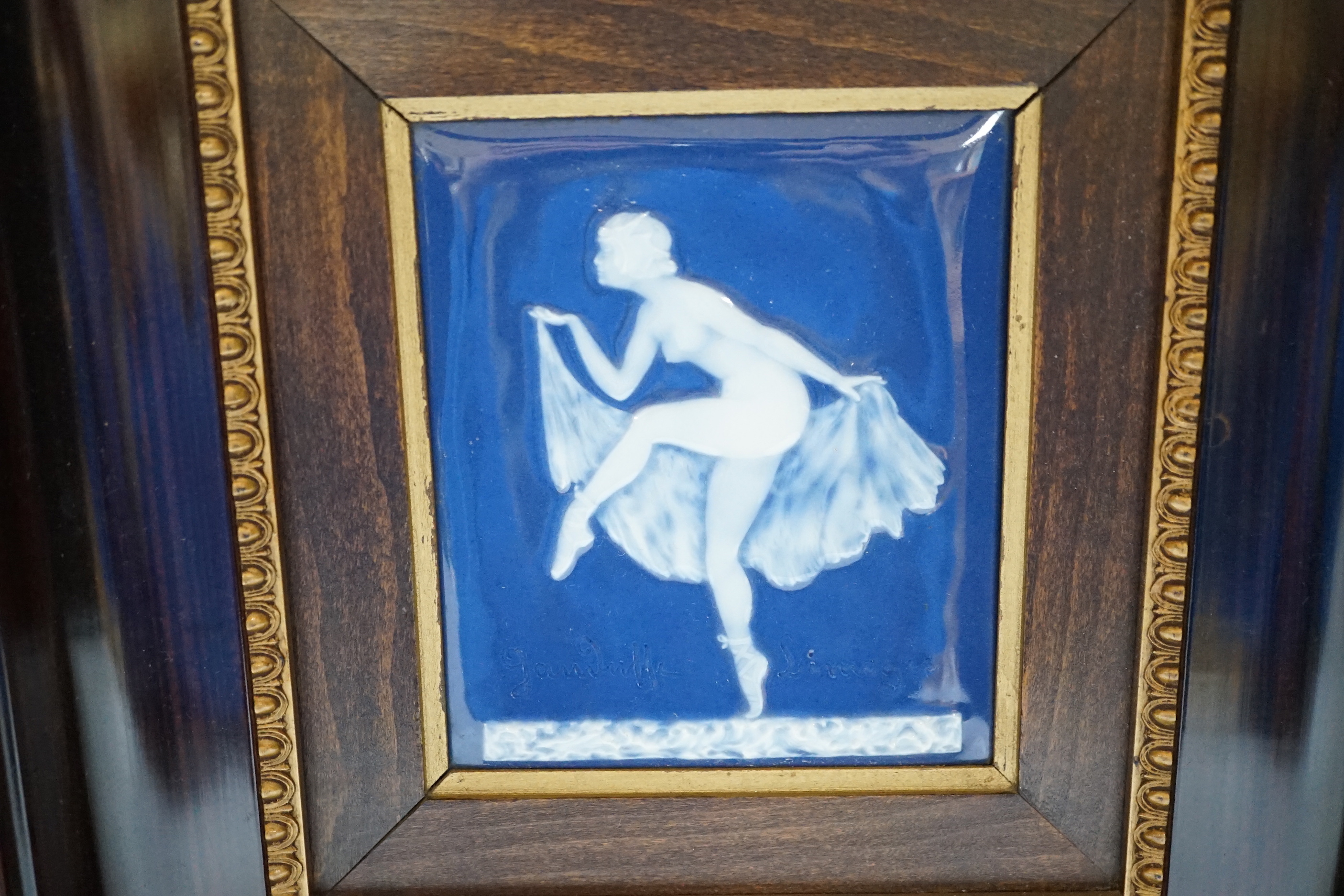 A Limoges pate sur pate plaque of a dancing girl, signed, 11cm wide x 13cm high